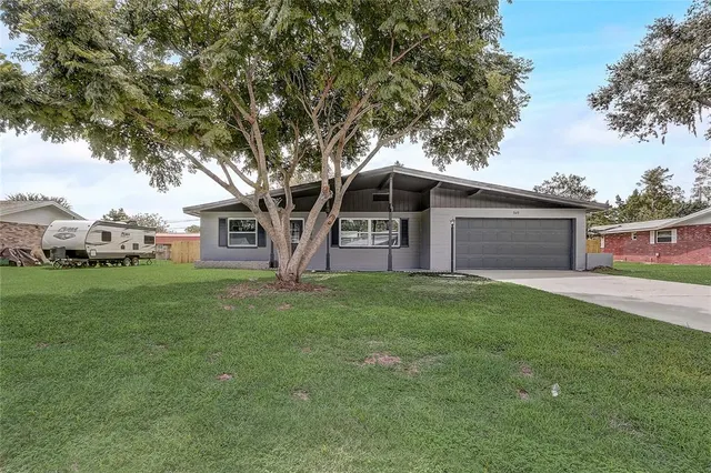 a view of a house with backyard from a porch