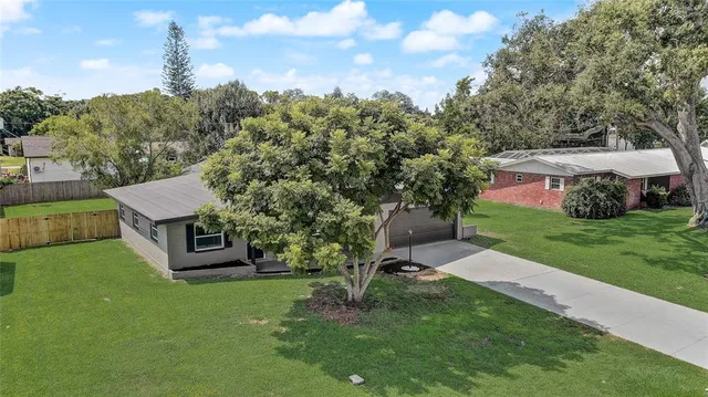 an aerial view of a house with a garden