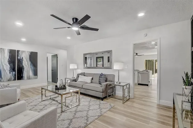 a kitchen with a stove a sink and a refrigerator
