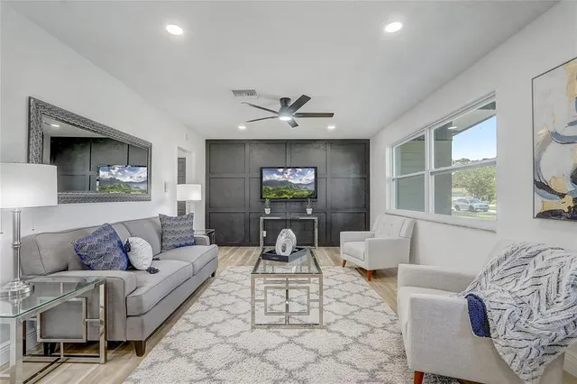 a kitchen with a stove sink and cabinets