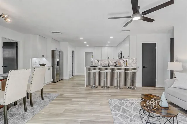 a room with a mirror and lamp