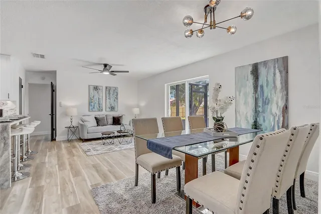 a kitchen with a refrigerator and a sink