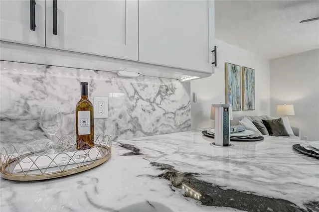 a bedroom with a bed and a table with wooden floor