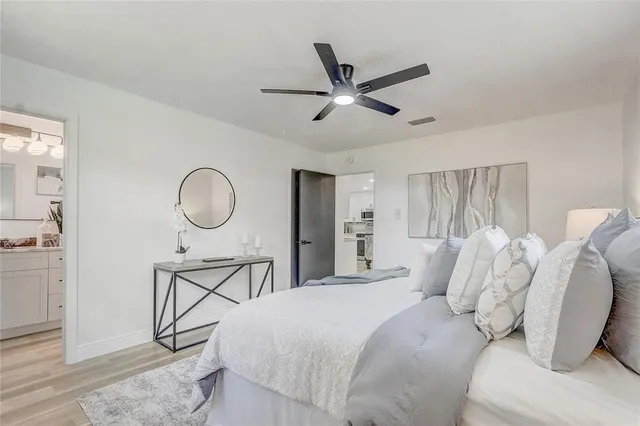 a view of a house with backyard and a tree