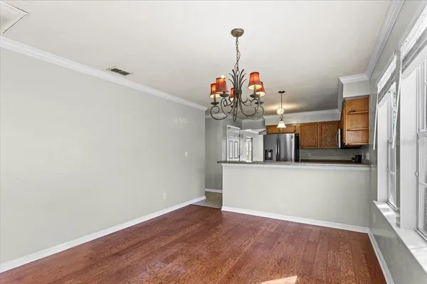 a view of a room with wooden floor and staircase