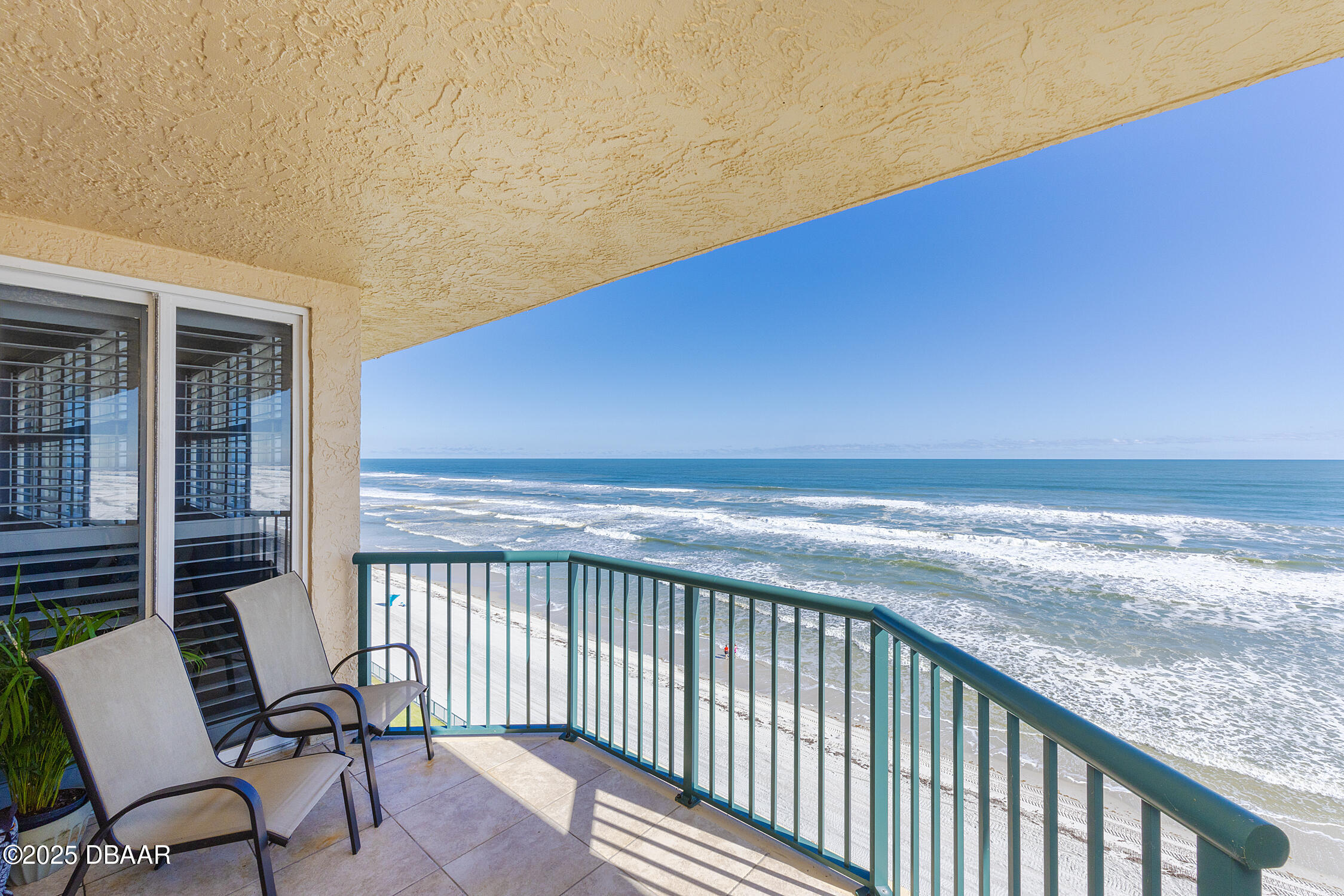 a view of a balcony with chair and table