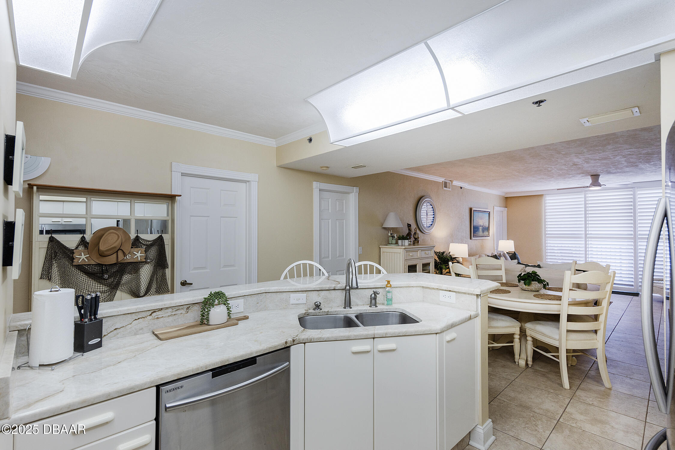 4545 South Atlantic Avenue, Unit 3704 Ponce Inlet, FL 32127 - Photo 18 of 66 a kitchen with sink and cabinets