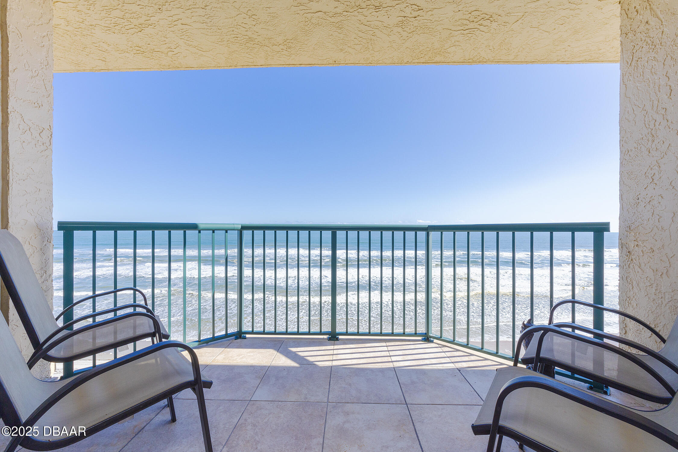4545 South Atlantic Avenue, Unit 3704 Ponce Inlet, FL 32127 - Photo 21 of 66 a view of a chair and table in the balcony