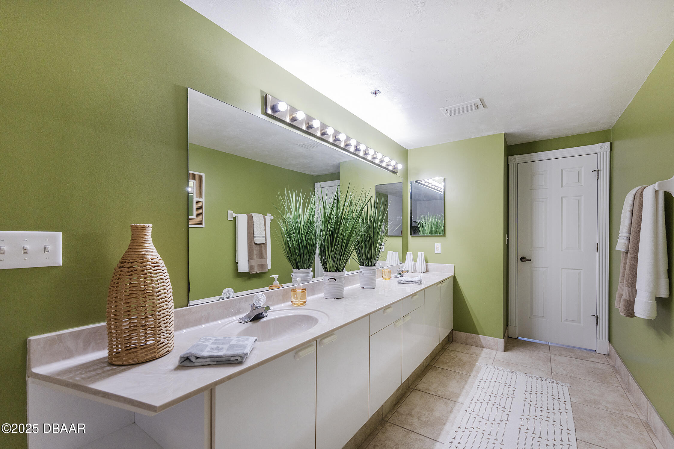 4545 South Atlantic Avenue, Unit 3704 Ponce Inlet, FL 32127 - Photo 28 of 66 a bathroom with a double vanity sink and a mirror