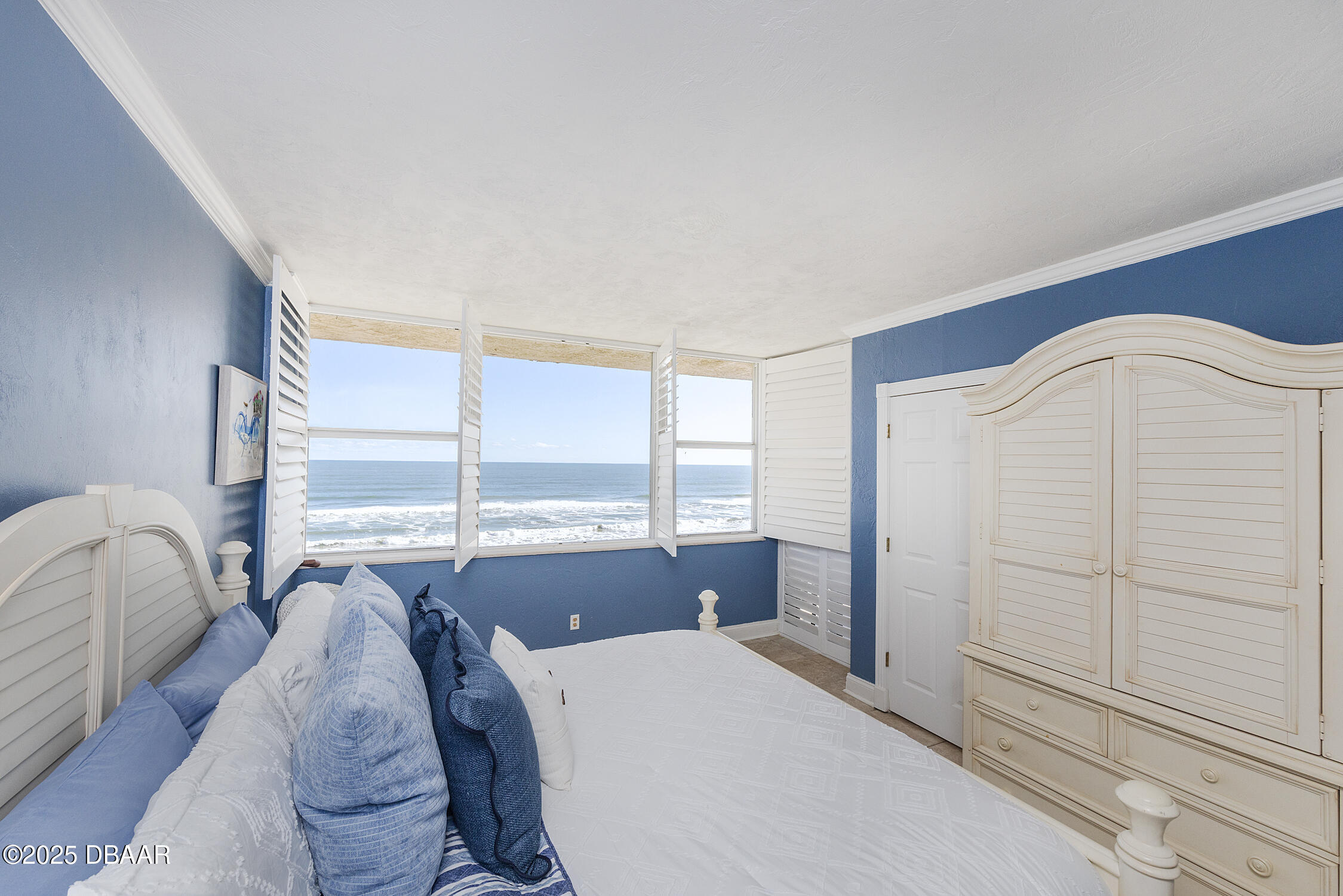 4545 South Atlantic Avenue, Unit 3704 Ponce Inlet, FL 32127 - Photo 34 of 66 a living room with furniture and large window