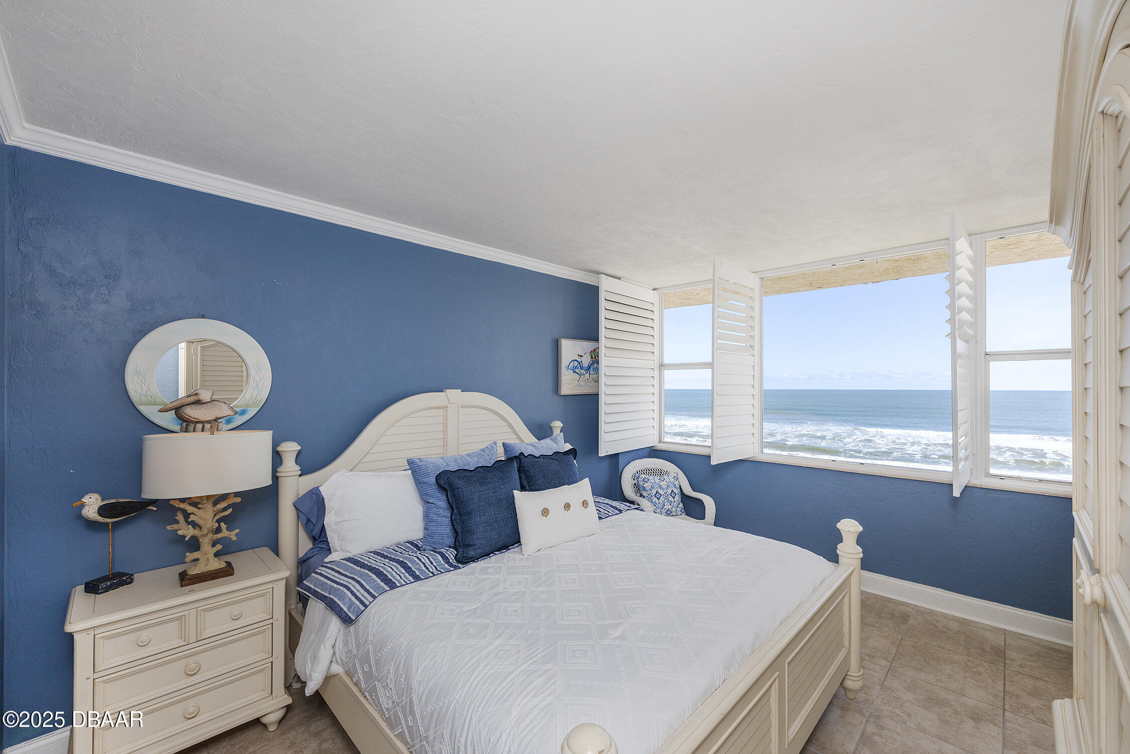 4545 South Atlantic Avenue, Unit 3704 Ponce Inlet, FL 32127 - Photo 36 of 66 a bedroom with bed and a large window