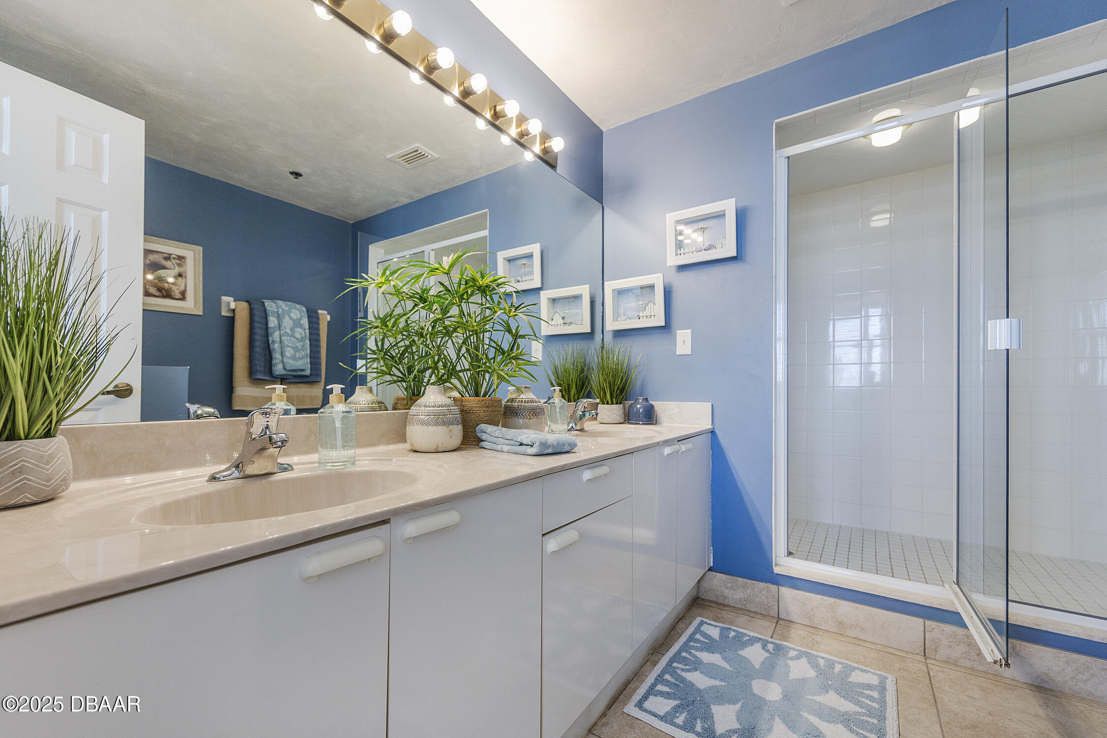 4545 South Atlantic Avenue, Unit 3704 Ponce Inlet, FL 32127 - Photo 37 of 66 a bathroom with a sink and a mirror