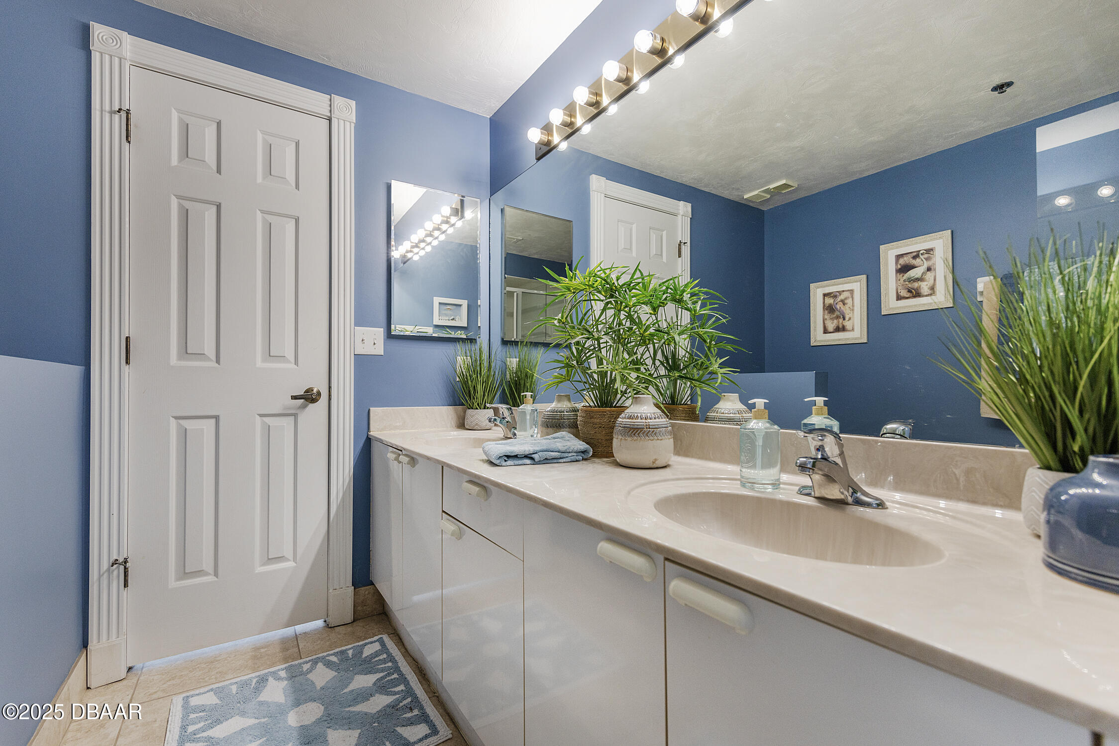 4545 South Atlantic Avenue, Unit 3704 Ponce Inlet, FL 32127 - Photo 38 of 66 a bathroom with a sink a vanity and a mirror
