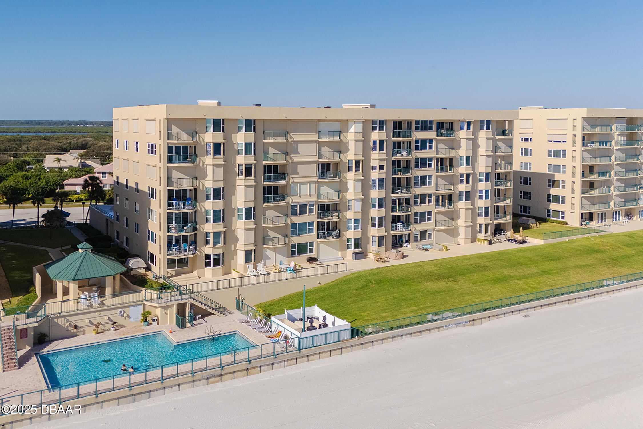 4545 South Atlantic Avenue, Unit 3704 Ponce Inlet, FL 32127 - Photo 39 of 66 a front view of a building with a garden and entertaining space