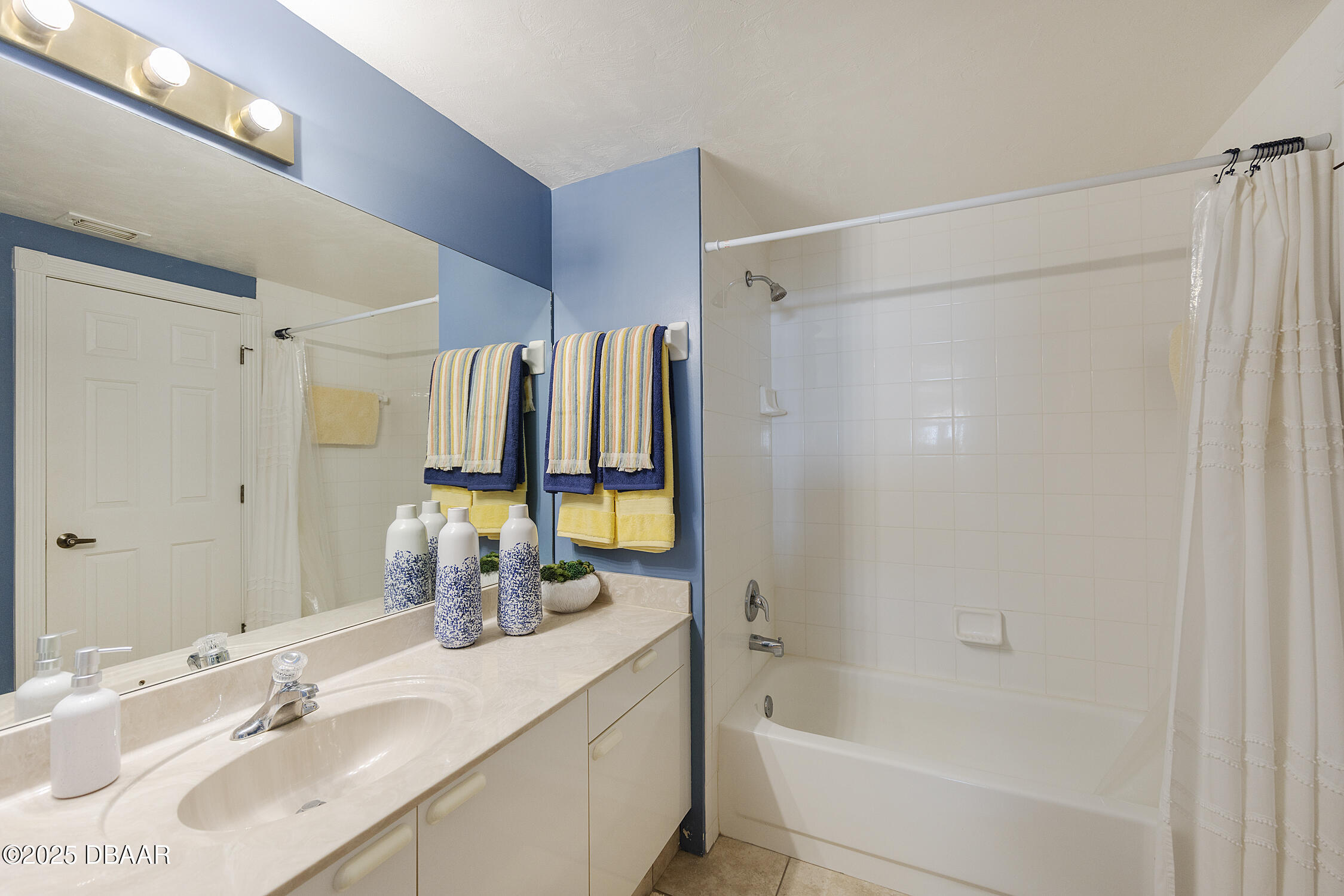4545 South Atlantic Avenue, Unit 3704 Ponce Inlet, FL 32127 - Photo 43 of 66 a bathroom with a double vanity sink a mirror and a bathtub