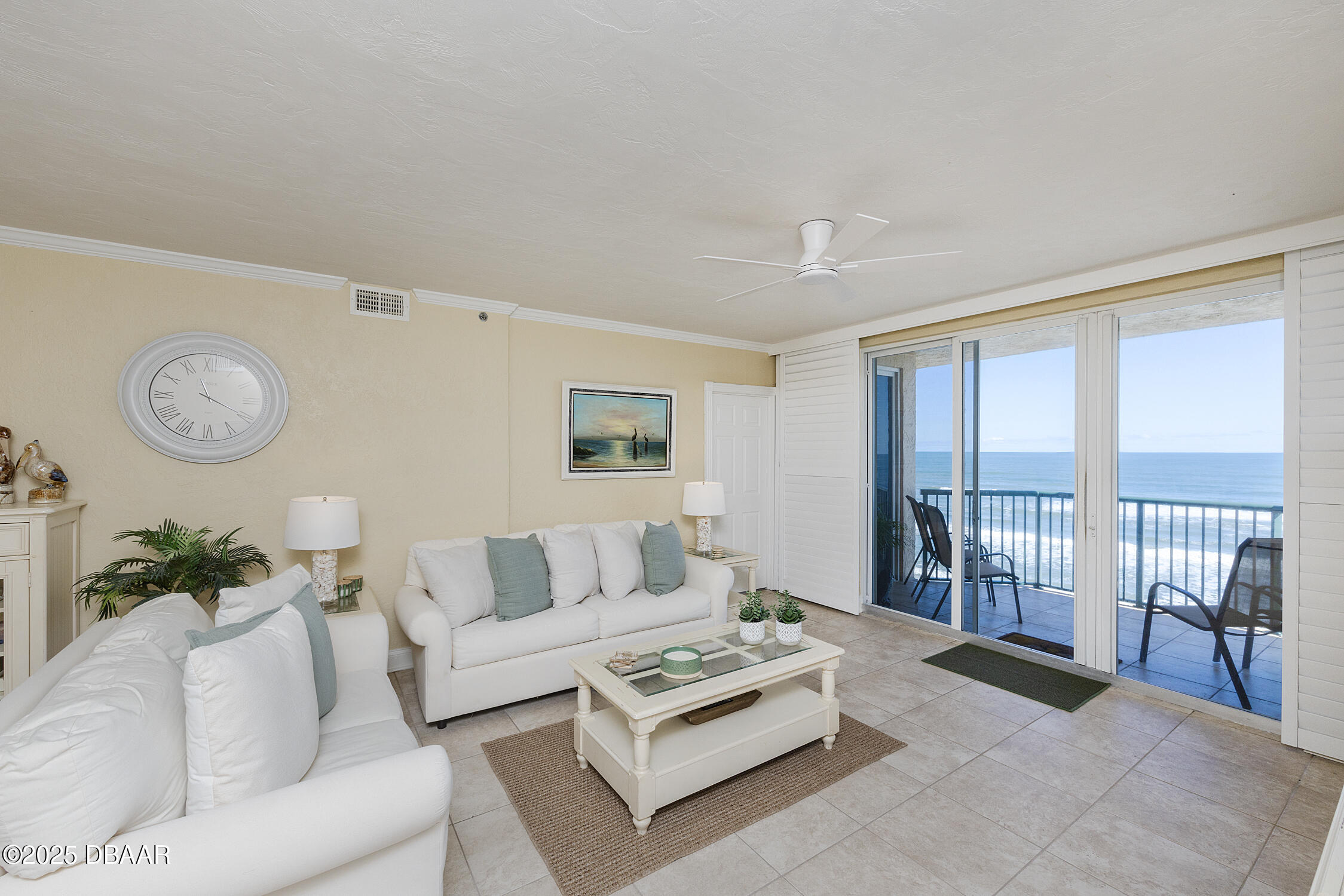 4545 South Atlantic Avenue, Unit 3704 Ponce Inlet, FL 32127 - Photo 7 of 66 a living room with furniture a rug potted plant and a large window