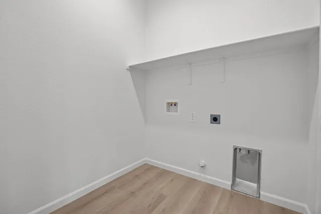 a living room with lots of furniture and kitchen view