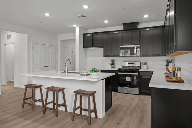 a bedroom with a bed couch and a window