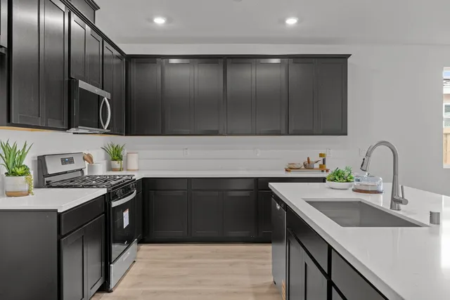 a bathroom with a sink double vanity and a mirror