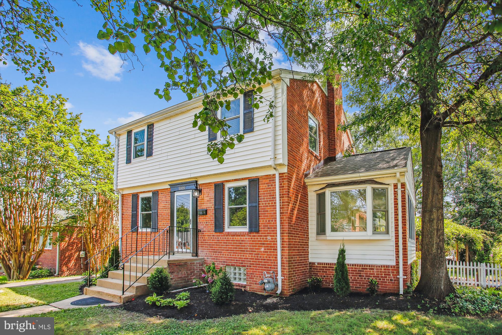 5909 Frederick Street Springfield, VA 22150 - Photo 1 of 62 front view of a house with a yard and an trees
