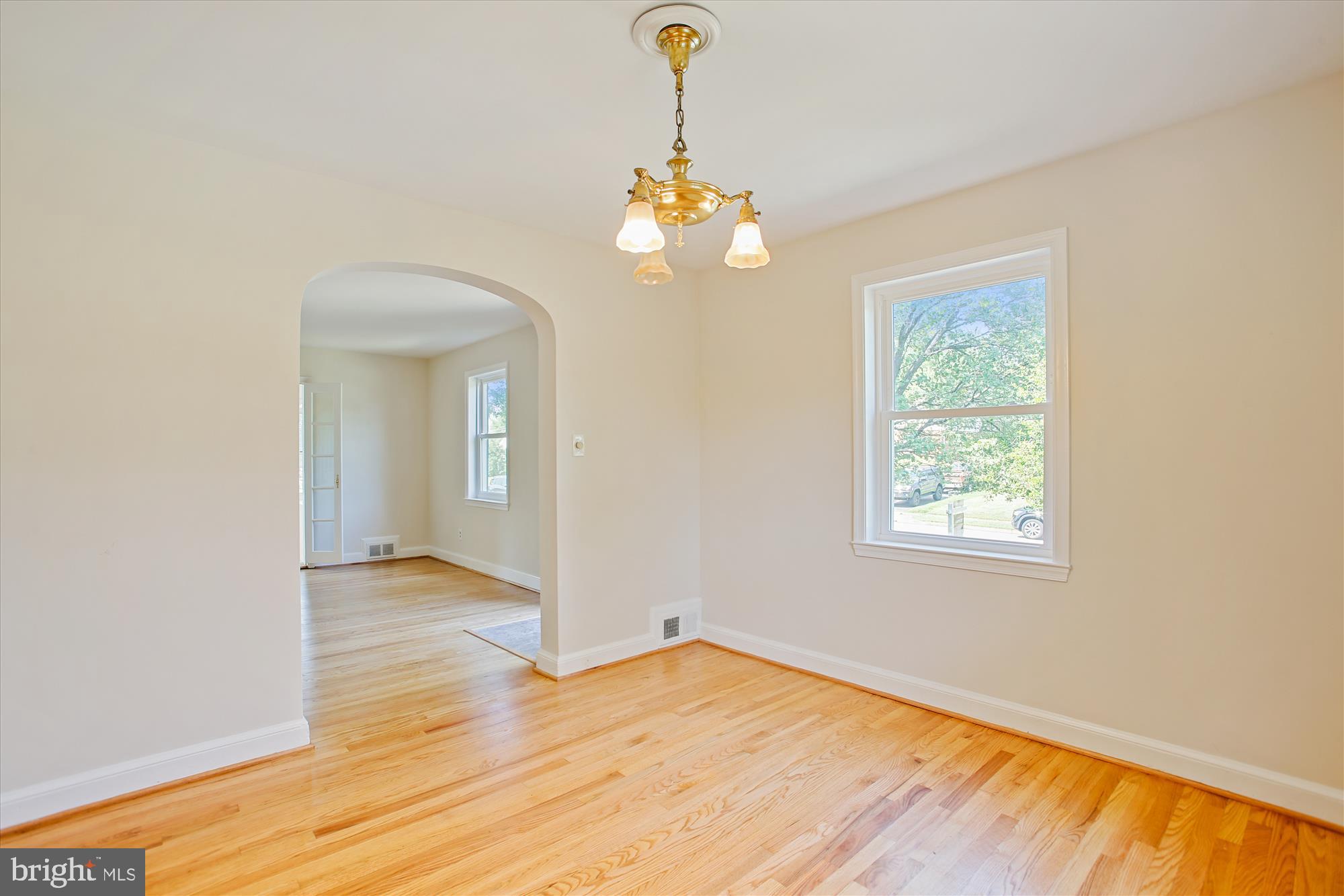 5909 Frederick Street Springfield, VA 22150 - Photo 15 of 62 wooden floor in an empty room with a window