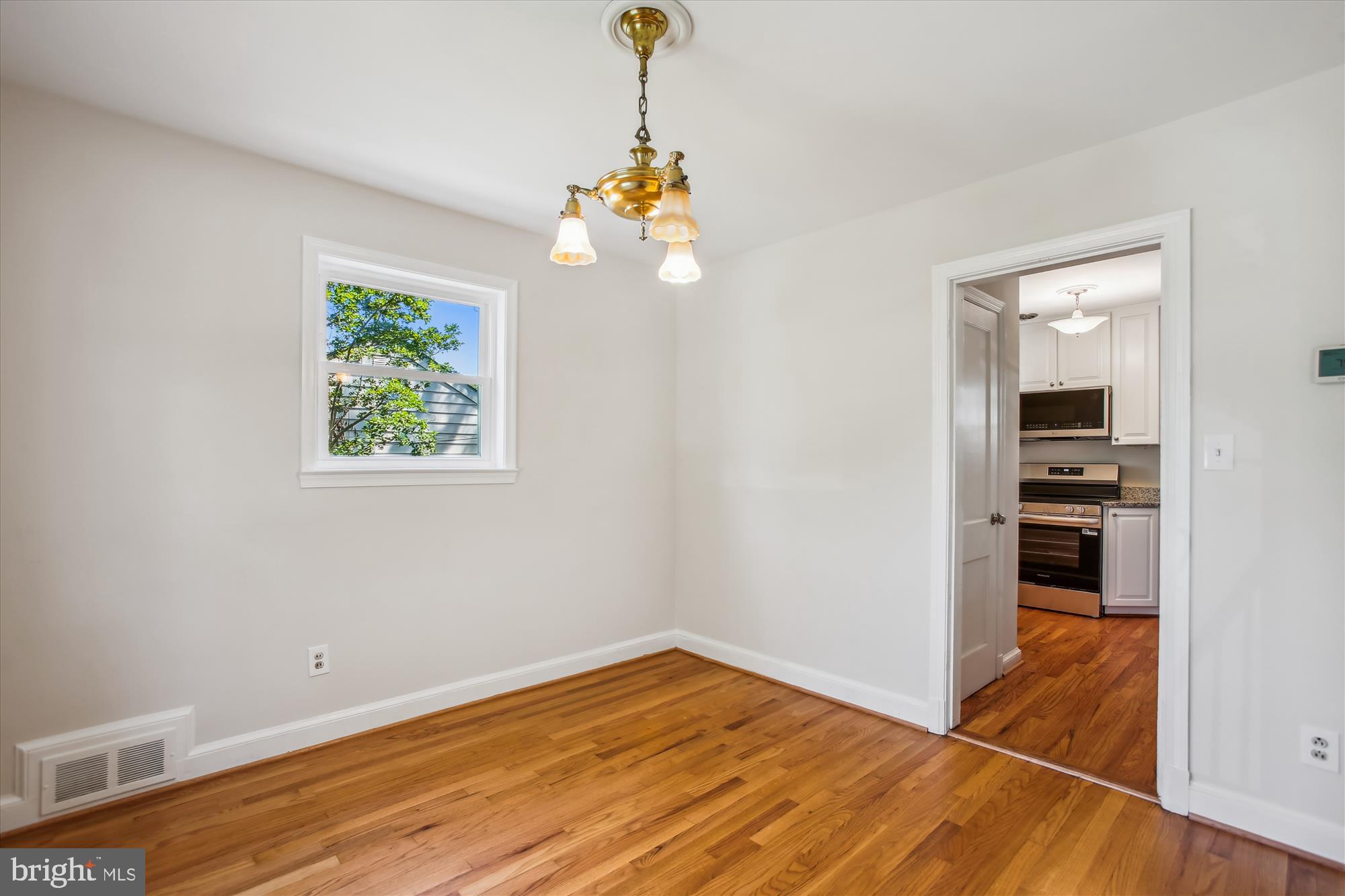 5909 Frederick Street Springfield, VA 22150 - Photo 17 of 62 a view of empty room with wooden floor and fan