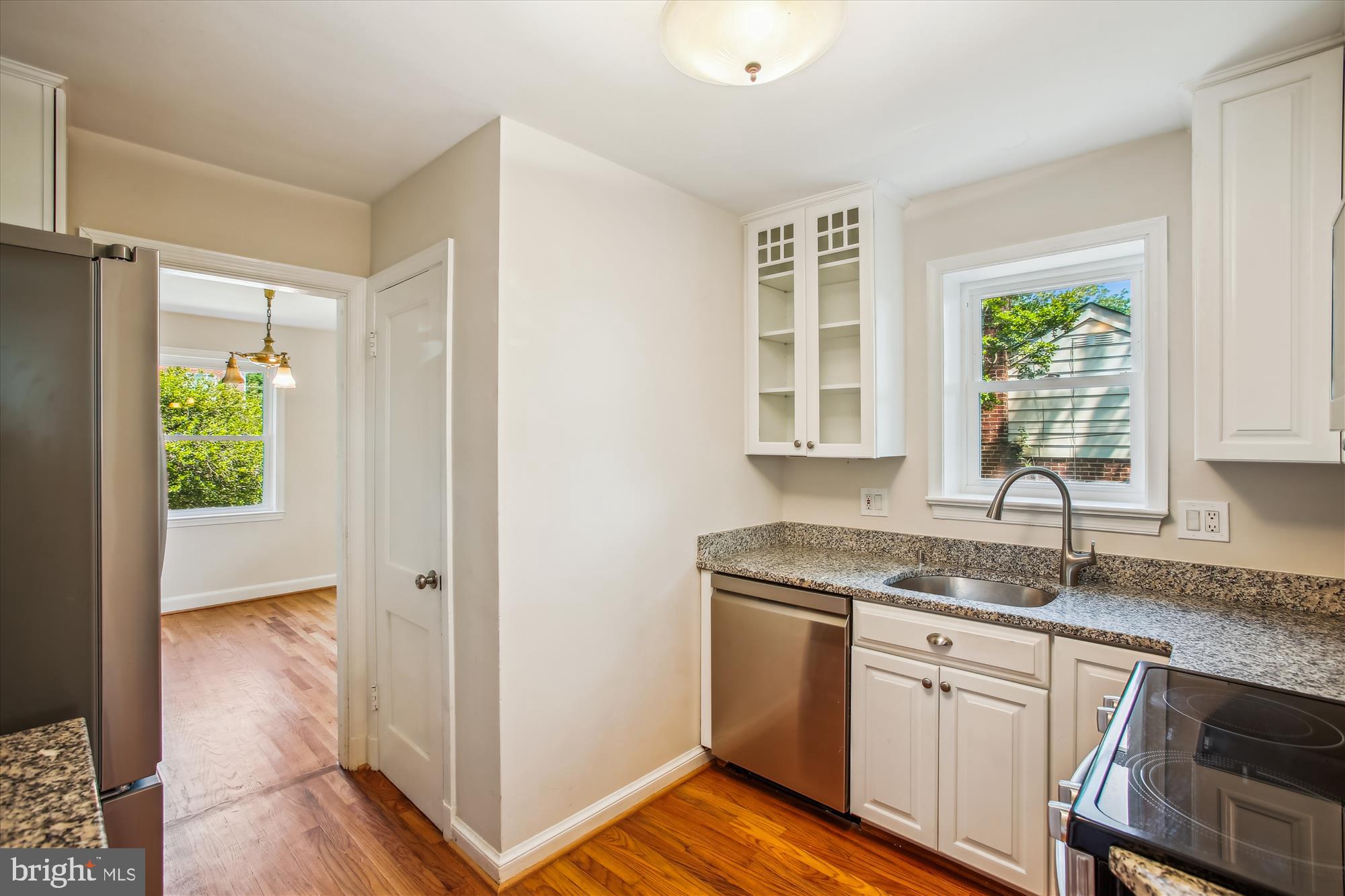 5909 Frederick Street Springfield, VA 22150 - Photo 18 of 62 a kitchen with granite countertop a sink and a window