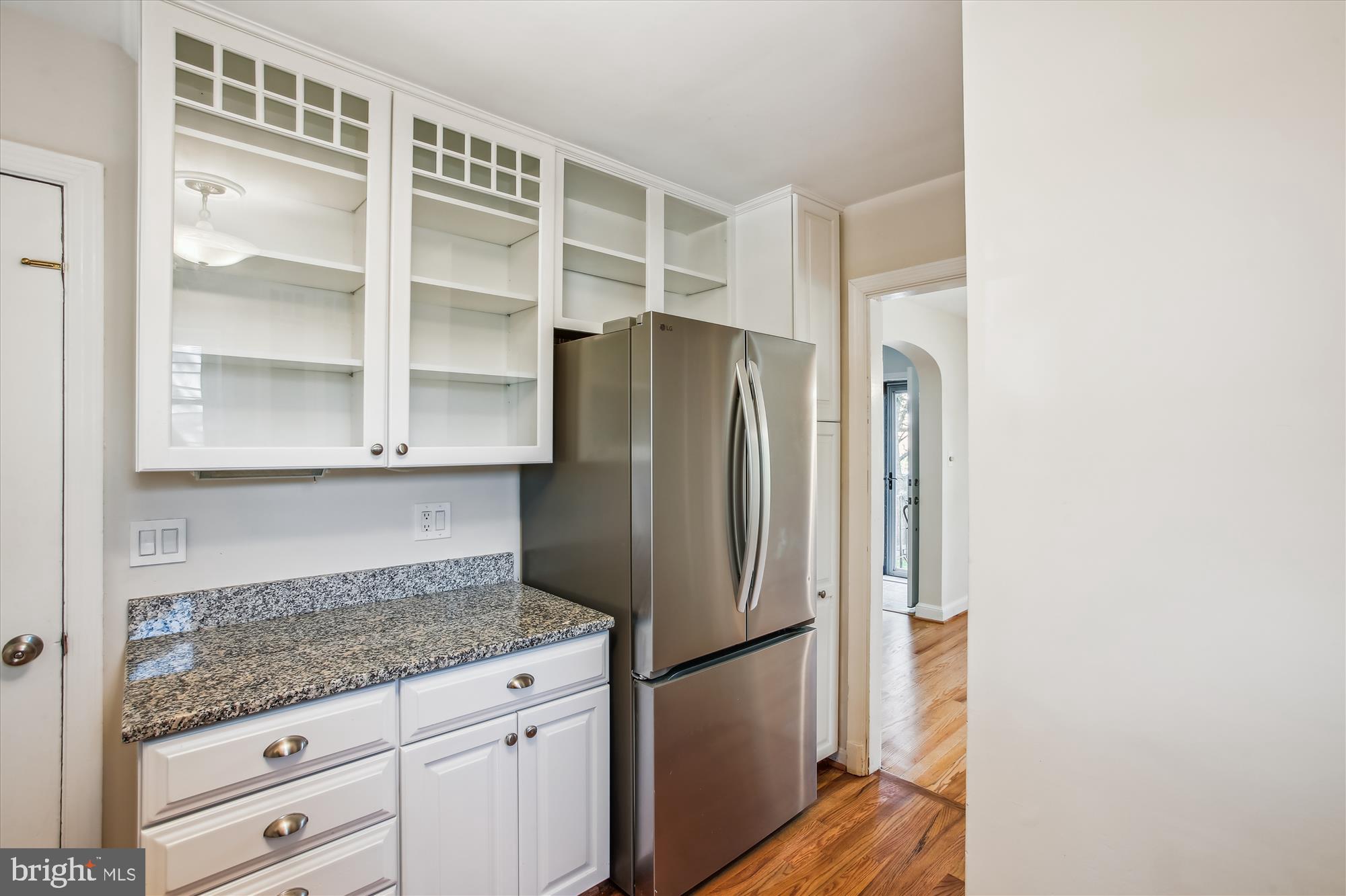 5909 Frederick Street Springfield, VA 22150 - Photo 20 of 62 a kitchen with granite countertop a refrigerator and a cabinets