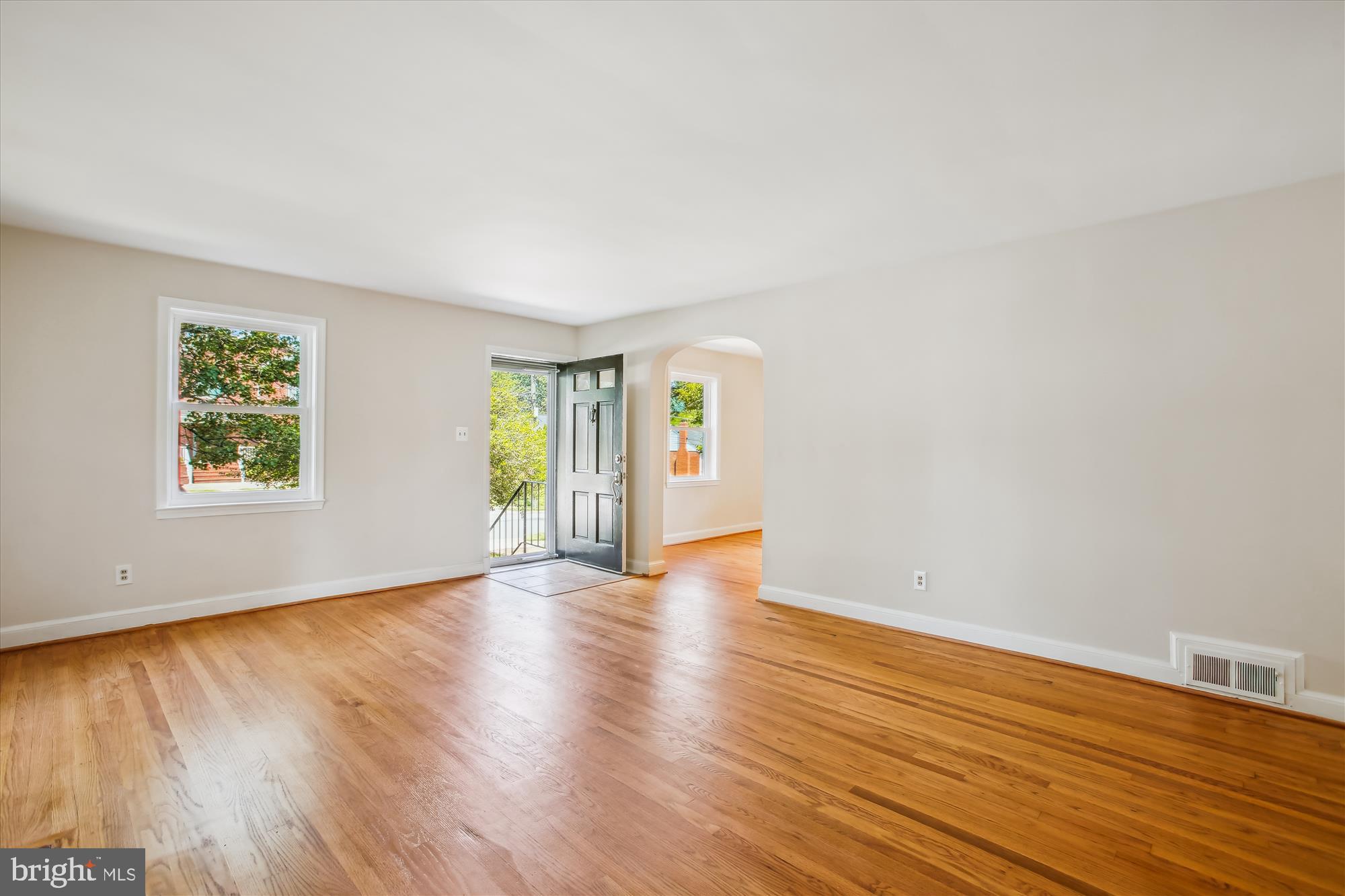 5909 Frederick Street Springfield, VA 22150 - Photo 2 of 62 an empty room with wooden floor and windows