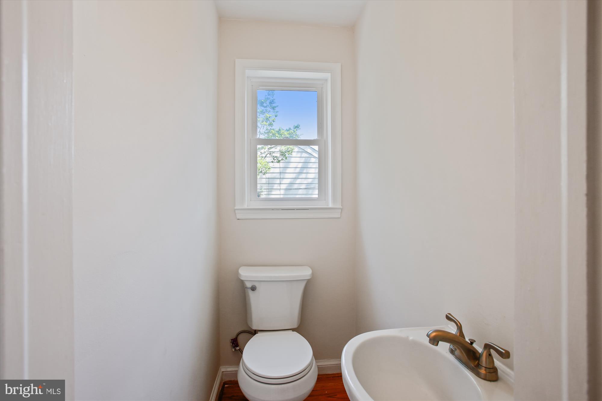 5909 Frederick Street Springfield, VA 22150 - Photo 21 of 62 a white toilet sitting next to a bathroom sink