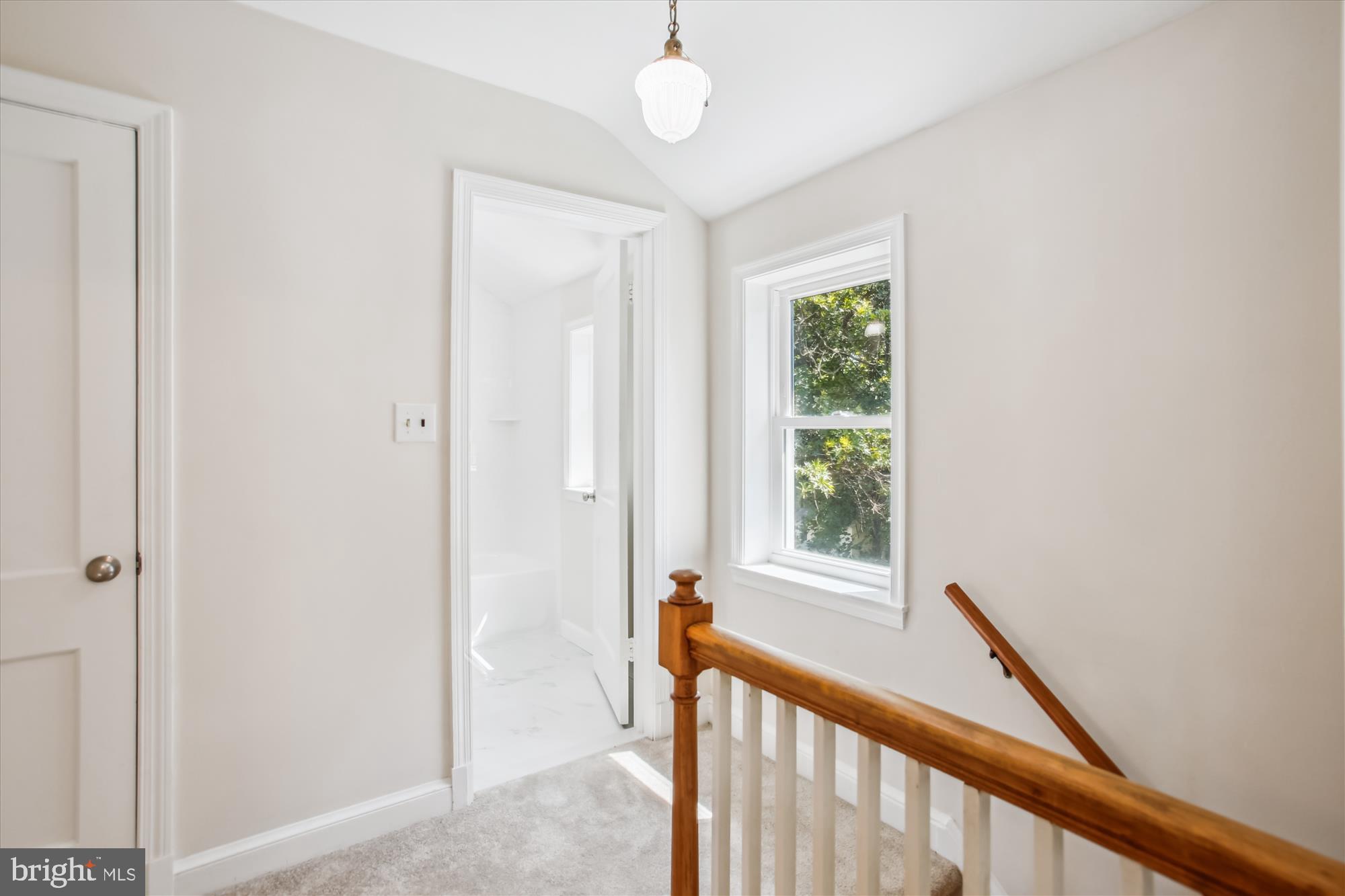 5909 Frederick Street Springfield, VA 22150 - Photo 23 of 62 a view of a hallway with windows