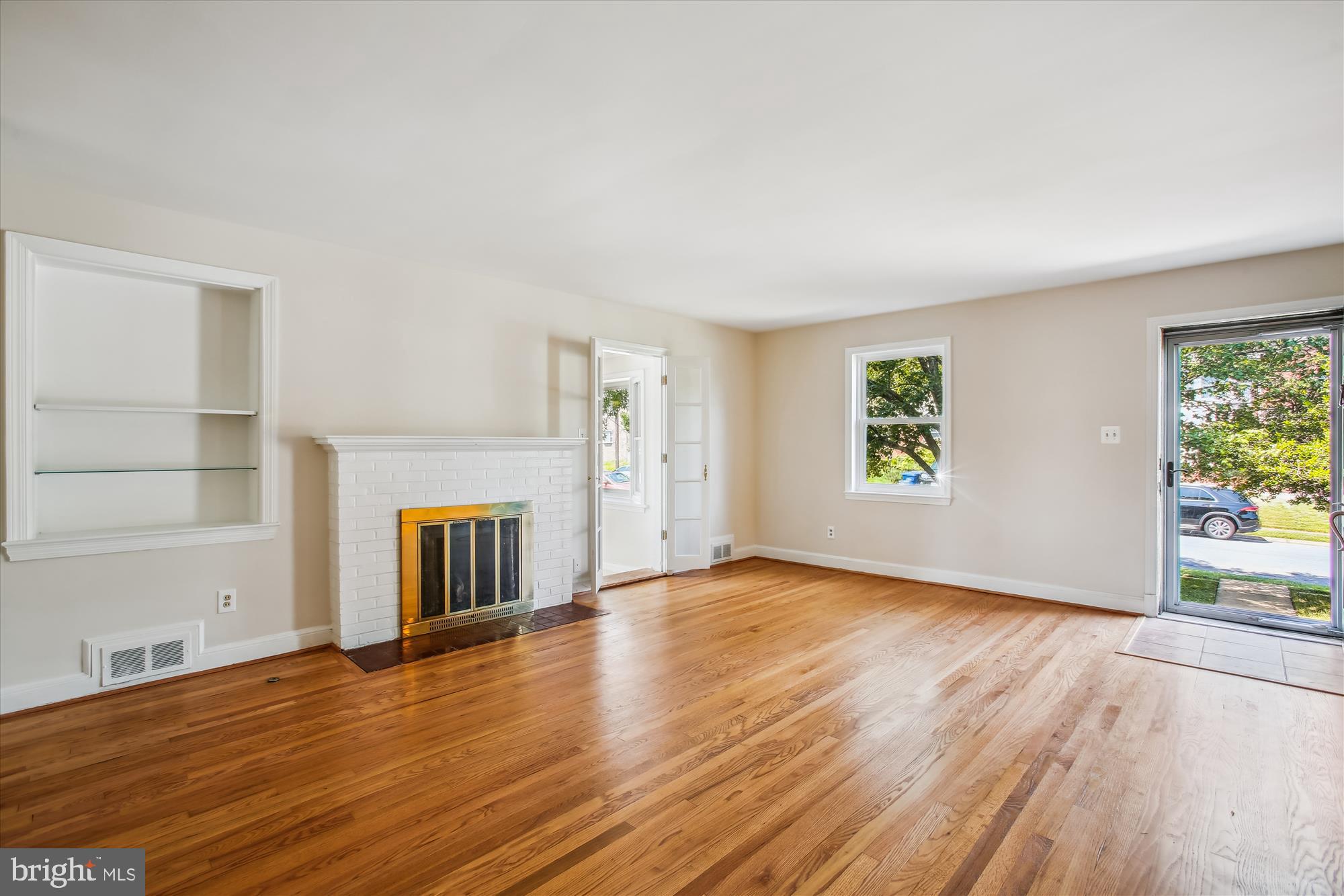 5909 Frederick Street Springfield, VA 22150 - Photo 3 of 62 an empty room with wooden floor and windows