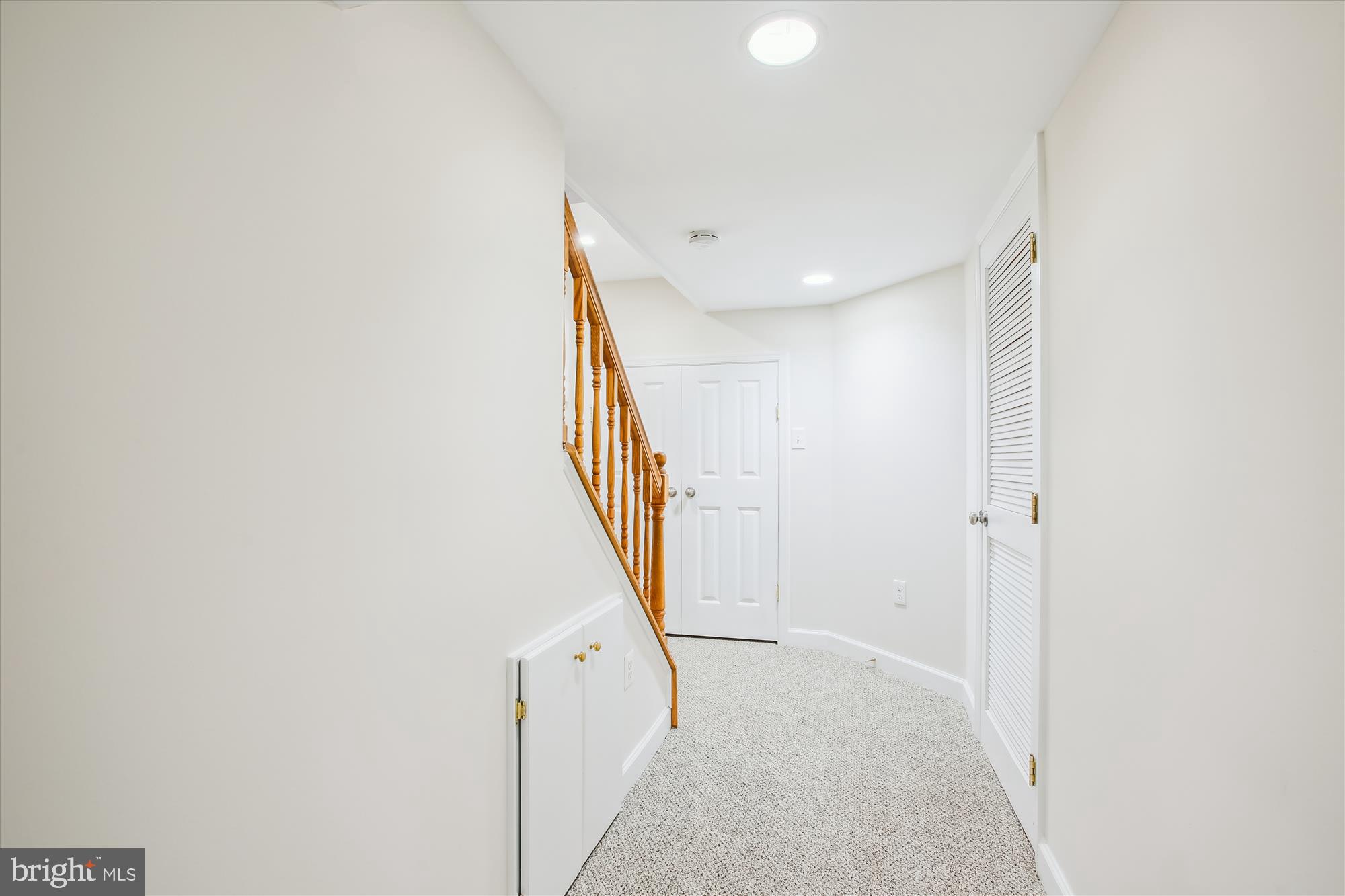 5909 Frederick Street Springfield, VA 22150 - Photo 36 of 62 a view of a hallway with staircase