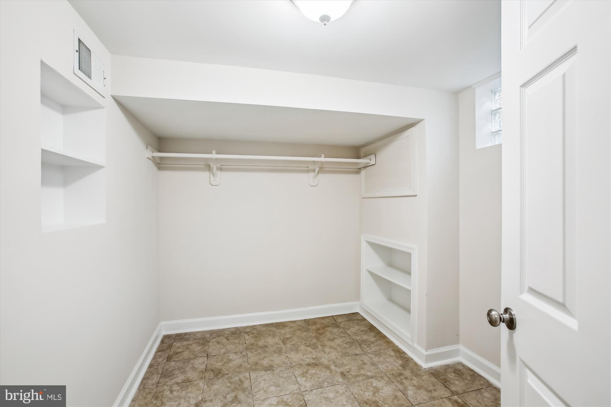 5909 Frederick Street Springfield, VA 22150 - Photo 41 of 62 a view of an empty walk in closet