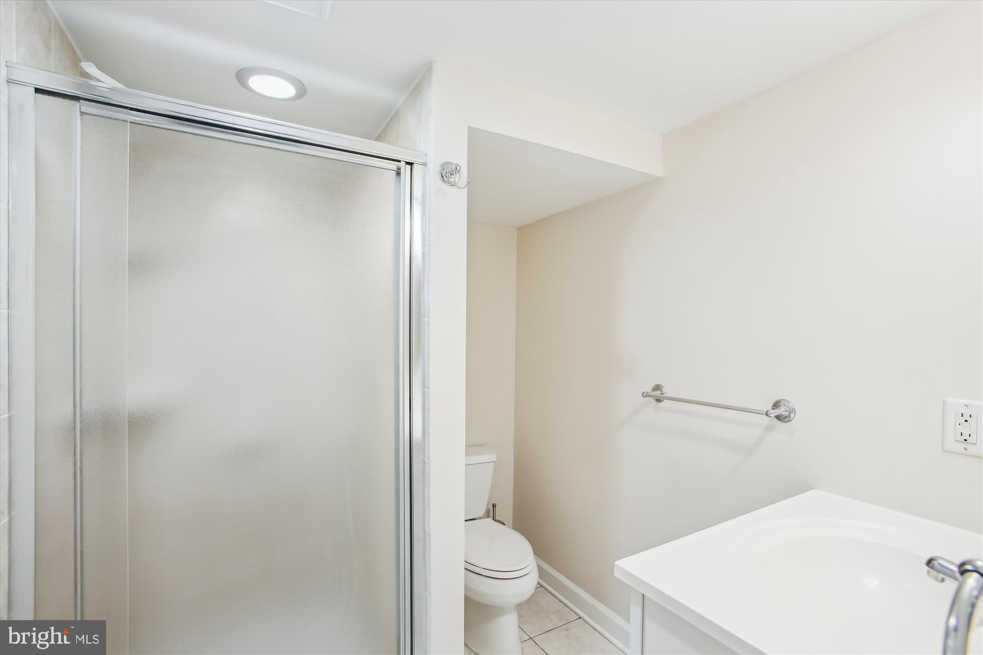5909 Frederick Street Springfield, VA 22150 - Photo 43 of 62 a bathroom with a shower and a toilet