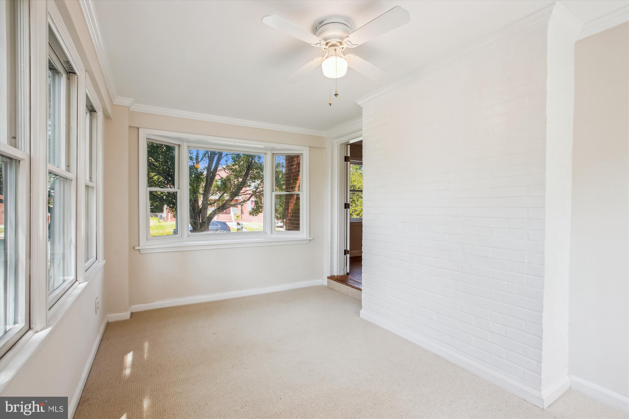 5909 Frederick Street Springfield, VA 22150 - Photo 8 of 62 an empty room with windows and fan