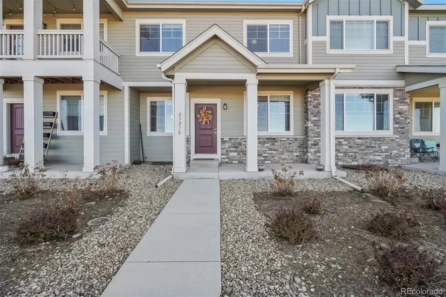a front view of a house with yard