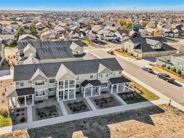 an aerial view of a house with a swimming pool
