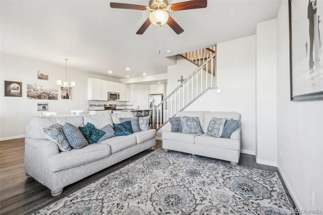 a living room with furniture and white walls