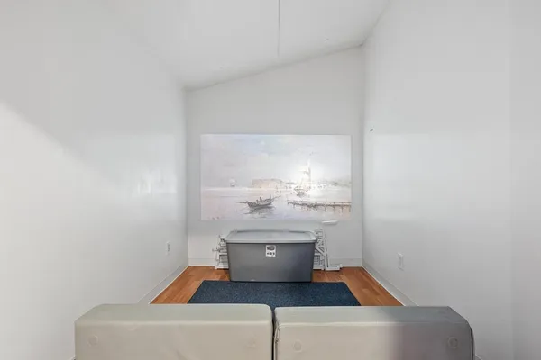 a bedroom with a large bed and a dresser