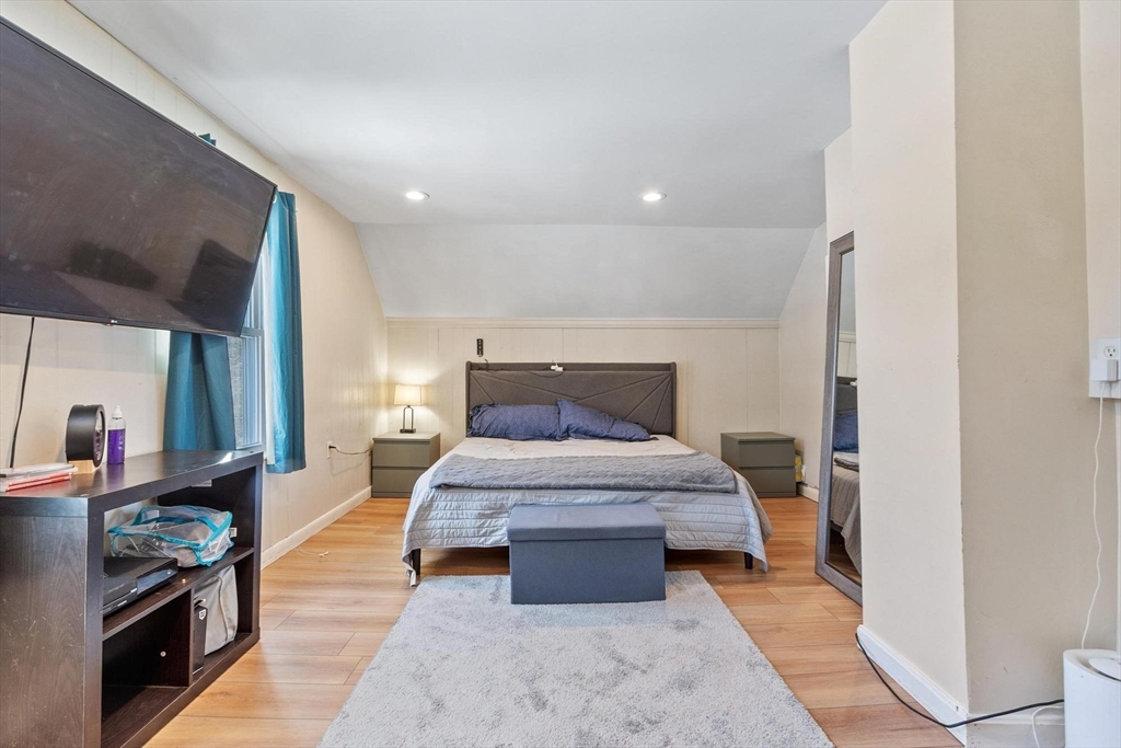 7 Jackson Street Gardner, MA 01440 - Photo 13 of 24 a bedroom with a large bed and a dresser