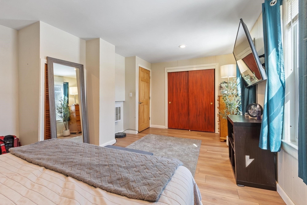 7 Jackson Street Gardner, MA 01440 - Photo 14 of 24 a bedroom with a bed and a mirror