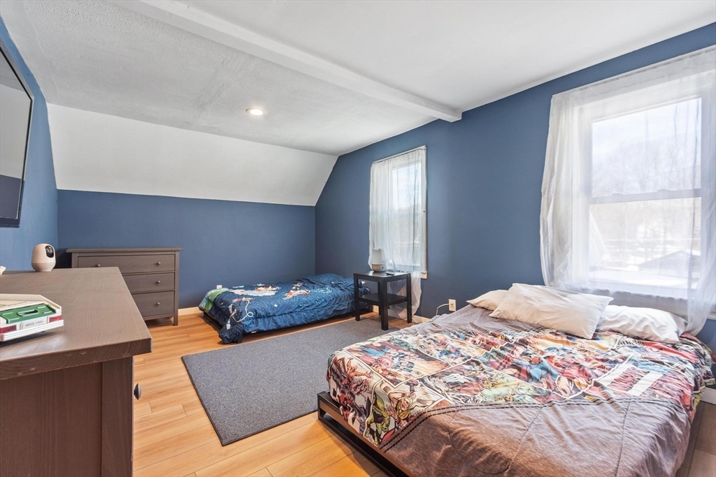 7 Jackson Street Gardner, MA 01440 - Photo 16 of 24 a bedroom with two beds and a window
