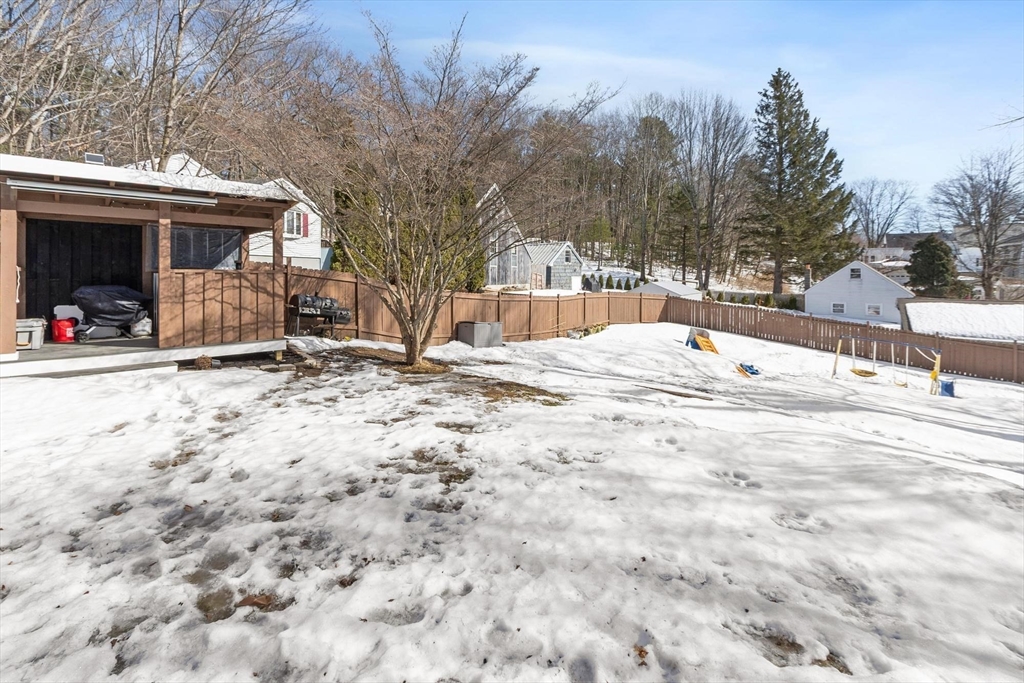 7 Jackson Street Gardner, MA 01440 - Photo 23 of 24 a swimming pool with outdoor seating and house in the background