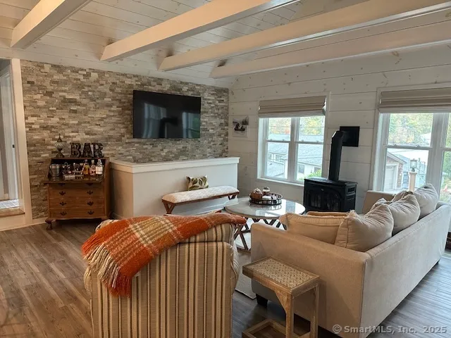 a bedroom with furniture and a fireplace