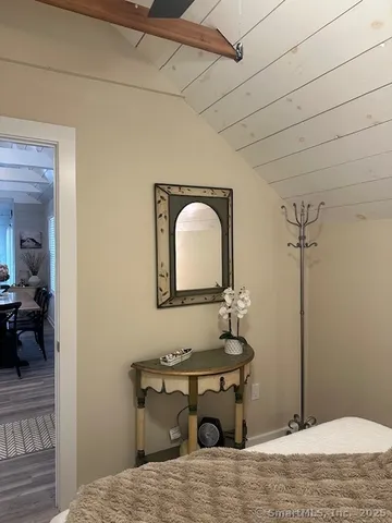 a bedroom with a bed and a table