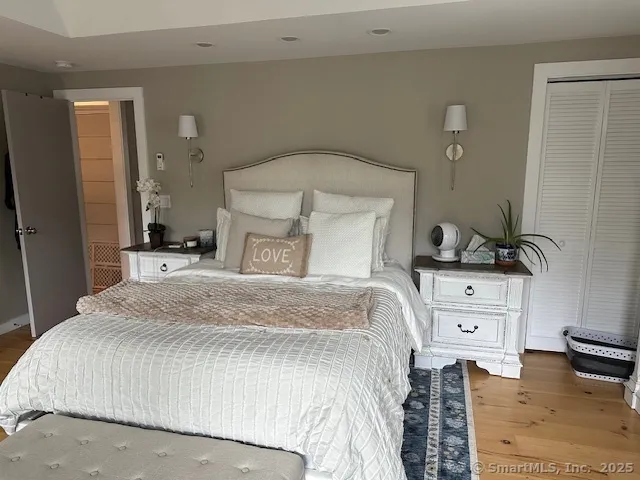 a bedroom with a bed and a dresser
