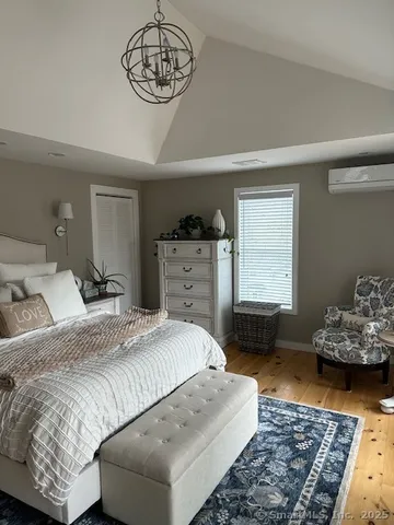 a bedroom with a bed and dresser