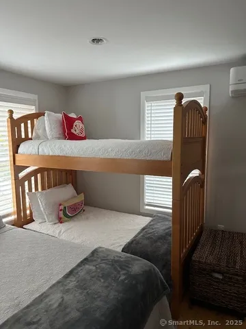 a bedroom with a bed and dresser