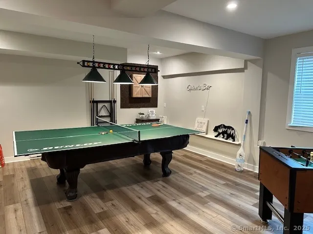 a living room with table soccer and a table